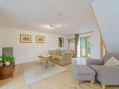 a living room with a couch and a table at 2 Bed in Aberystwyth oc-83552 in Llanilar