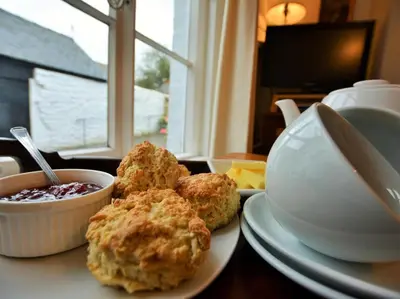 a table with two biscuits and a bowl of food at 1 Bed in Presteigne oc-55285 in Presteigne