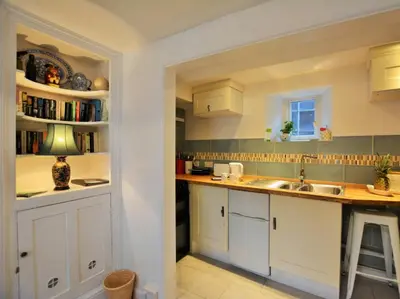 a kitchen with white cabinets and a sink at 1 Bed in Presteigne oc-55285 in Presteigne