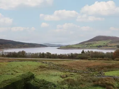 a view of a lake with hills in the background at Craig Yr Ronwy in Bala