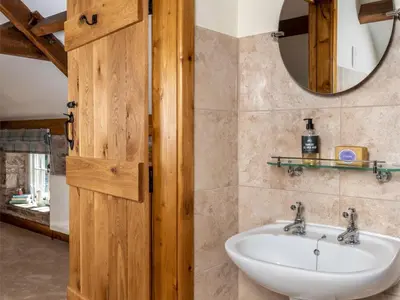 a bathroom with a sink and a mirror at 1 Bed in Brecon oc-bn270 in Llansantffread