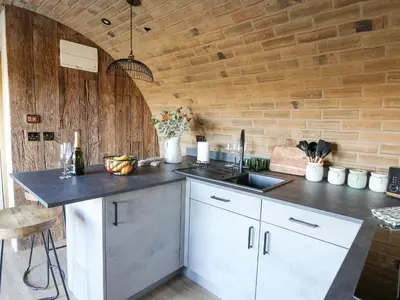 a kitchen with a sink and a counter top at Tan y Wawr- Onnen in Welshpool