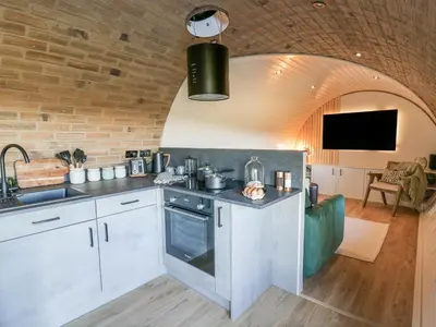 a kitchen with a sink and a counter top at Tan y Wawr- Onnen in Welshpool