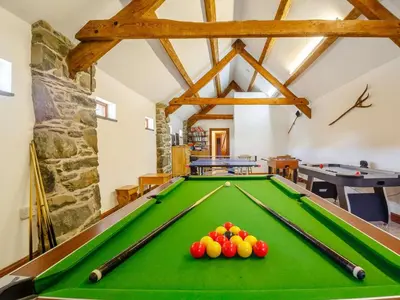 a pool table with balls on it in a room at 2 Bed in Dyffryn Ardudwy oc-89438 in Dyffryn