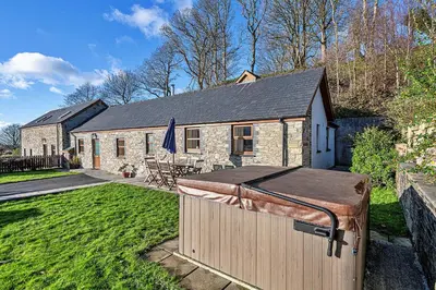 a house with a large object in the yard at Finest Retreats - Eithinog in Talybont