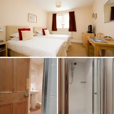 a hotel room with two beds and a shower at Fron Haul in Aberdyfi
