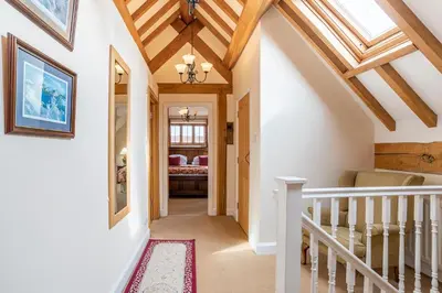 a hallway with a ceiling with skylights at The Town House Ludlow in Ludlow