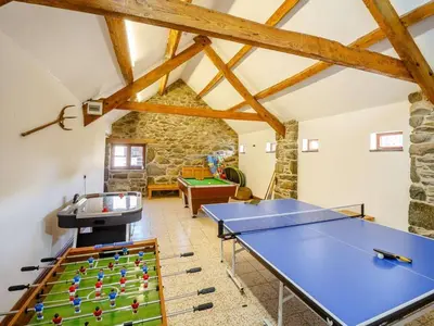 a room with a ping pong table and a pool table at 1 Bed in Dyffryn Ardudwy oc-89395 in Dyffryn