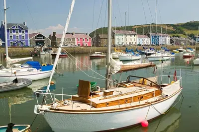 a sail boat docked in a harbor with other boats at 3 Bed in Aberaeron oc-b27954 in Aberaeron