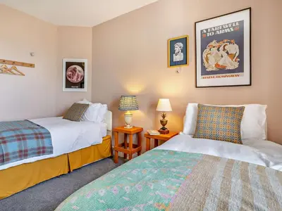 two beds in a room with two lamps at 4 Bed in Hereford oc-80464 in Glasbury