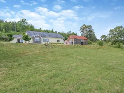 an open field with a house and a barn at 2 Bed in Llangammarch Wells oc-bn059 in Garth