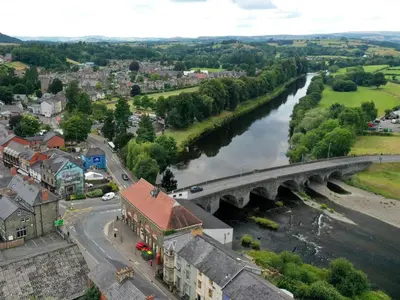 a bridge over a river in a town at 2 Bed in Llandrindod Wells oc-89063 in Nantmel
