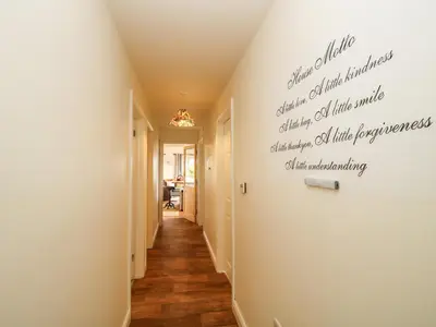a hallway with a writing on the wall at Dragonfly Lodge in Shrewsbury