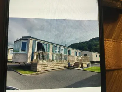 a mobile home with a porch and a house at H2 in Aberystwyth