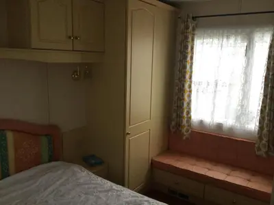 a small bedroom with a bed and a window at H2 in Aberystwyth