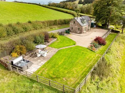 an aerial view of a house in a field at Waun Yscir Rural escape in the Brecon Beacons in Brecon
