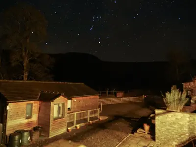 a house at night with the stars in the sky at The Old Stables in Presteigne