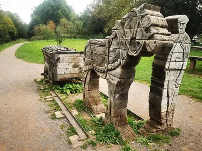a statue of an elephant standing next to a road at Rhif Deg in Brecon