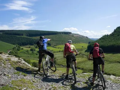 a group of people riding bikes on a hill at 3 Bed in Clyro 88077 in Clyro