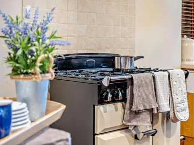 a kitchen with a stove with a pot on it at 3 Bed in Brecon oc-bn430 in Llangorse