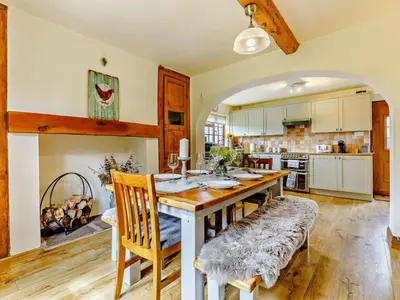 a kitchen with a large wooden table and chairs at 4 Bed in Hereford oc-44213 in Hereford