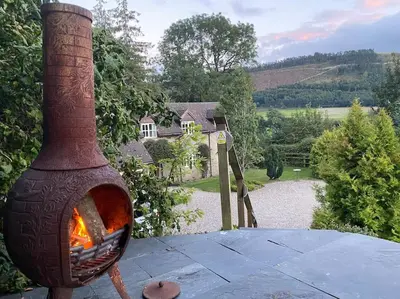 a wood fired oven sitting on top of a table at Quarry House in Presteigne