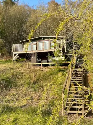 a house on a hill with a staircase leading up to it at Quarry House in Presteigne