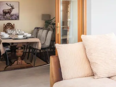 a living room with a table and a couch at 5 Bed in Aberystwyth oc-58889 in Llanrhystyd
