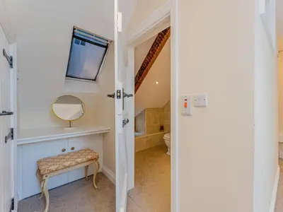 a bathroom with a toilet and a mirror at 5 Bed in Aberystwyth oc-58889 in Llanrhystyd