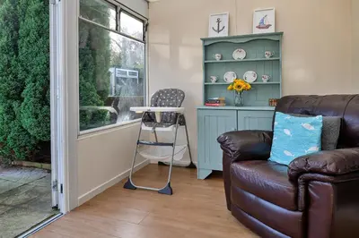 a living room with a couch and a table at Finest Retreats - 37 Bro Enddwyn in Dyffryn