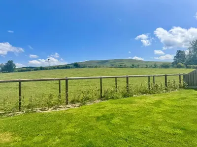a fence in the middle of a green field at 1 Bed in Rhayader oc-90278 in Saint Harmon