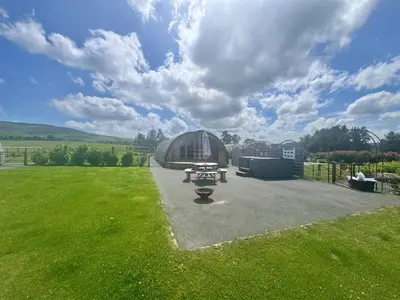 a large dome building with a picnic table in a yard at 2 Bed in Rhayader oc-90279 in Saint Harmon