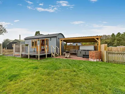 a caravan in a yard with a fence at 1 Bed in Rhayader oc-90285 in Saint Harmon