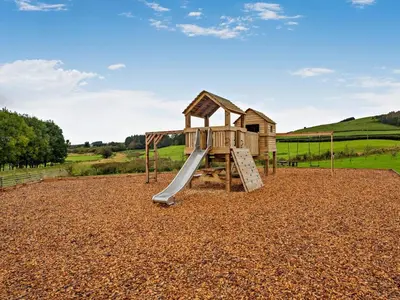 a playground with a slide in a gravel field at 1 Bed in Rhayader oc-90285 in Saint Harmon