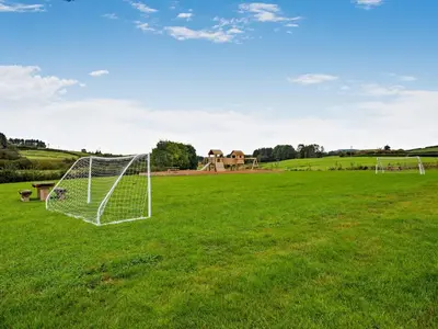 a soccer field with a goal in the grass at 1 Bed in Rhayader oc-90285 in Saint Harmon