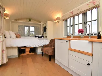 a kitchen with a sink and a bed in a room at 1 Bed in Rhayader oc-90277 in Saint Harmon