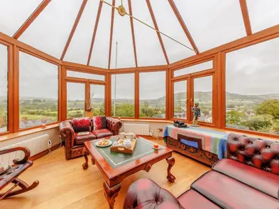 a living room with a large glass ceiling at 3 Bed in Corwen oc-90459 in Corwen