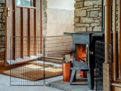 a stove with a chair in front of a building at 4 Bed in Painscastle 90375 in Builth Wells