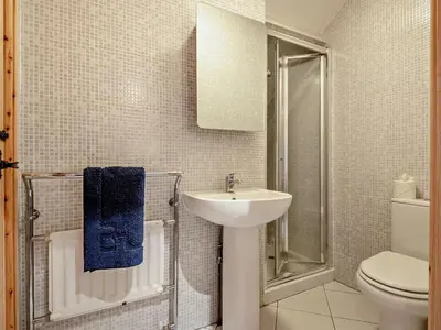 a white bathroom with a sink and a toilet at 2 Bed in Brecon oc-91085 in Llangorse