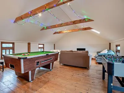 a living room with a pool table and a couch at 2 Bed in Brecon oc-91085 in Llangorse