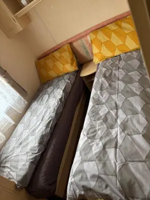 two beds in a small room in a room at Haven on the Hill 2 Bed Caravan with Town Views of Aberystwyth F7 in Aberystwyth