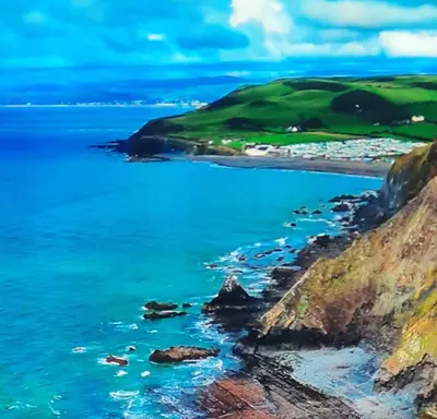 a view of the ocean and a beach at Hilltop Hideaway 2 Bed Caravan with Panoramic Town Scenery in Aberystwyth Holiday Village F8 in Aberystwyth