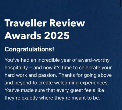 a sign that says travelrelyer review awards at Brecon serviced apartments- Kian Perrott Properties in Brecon