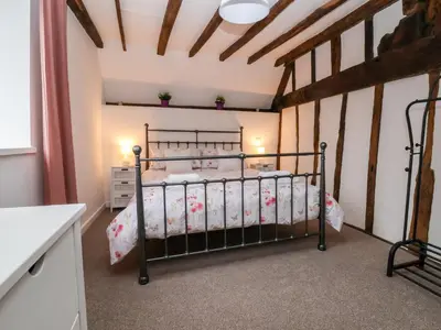 a bedroom with a bed in a room at The Brewhouse in Church Stretton