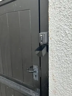 a metal door with a meter on the side of a building at Dolgoch Mill House Annexe in Llanfair Caereinion