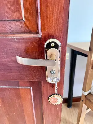 a wooden door with a key hanging from it at King room - PenrhynCoch - Aberystwyth in Aberystwyth