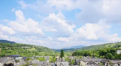 a view of a town with mountains in the background at Mountain View Home - Dolgellau in Dolgellau