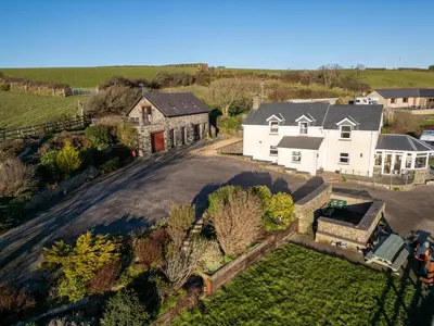 an aerial view of a house with a driveway at Crogal Stable in New Quay