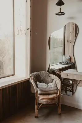 a chair in a room with a mirror at 3 x bespoke built cabins with hot tubs, mid Wales in Newtown