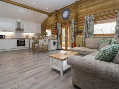 a living room with a couch and a table at Redwood Lodge in Ellesmere